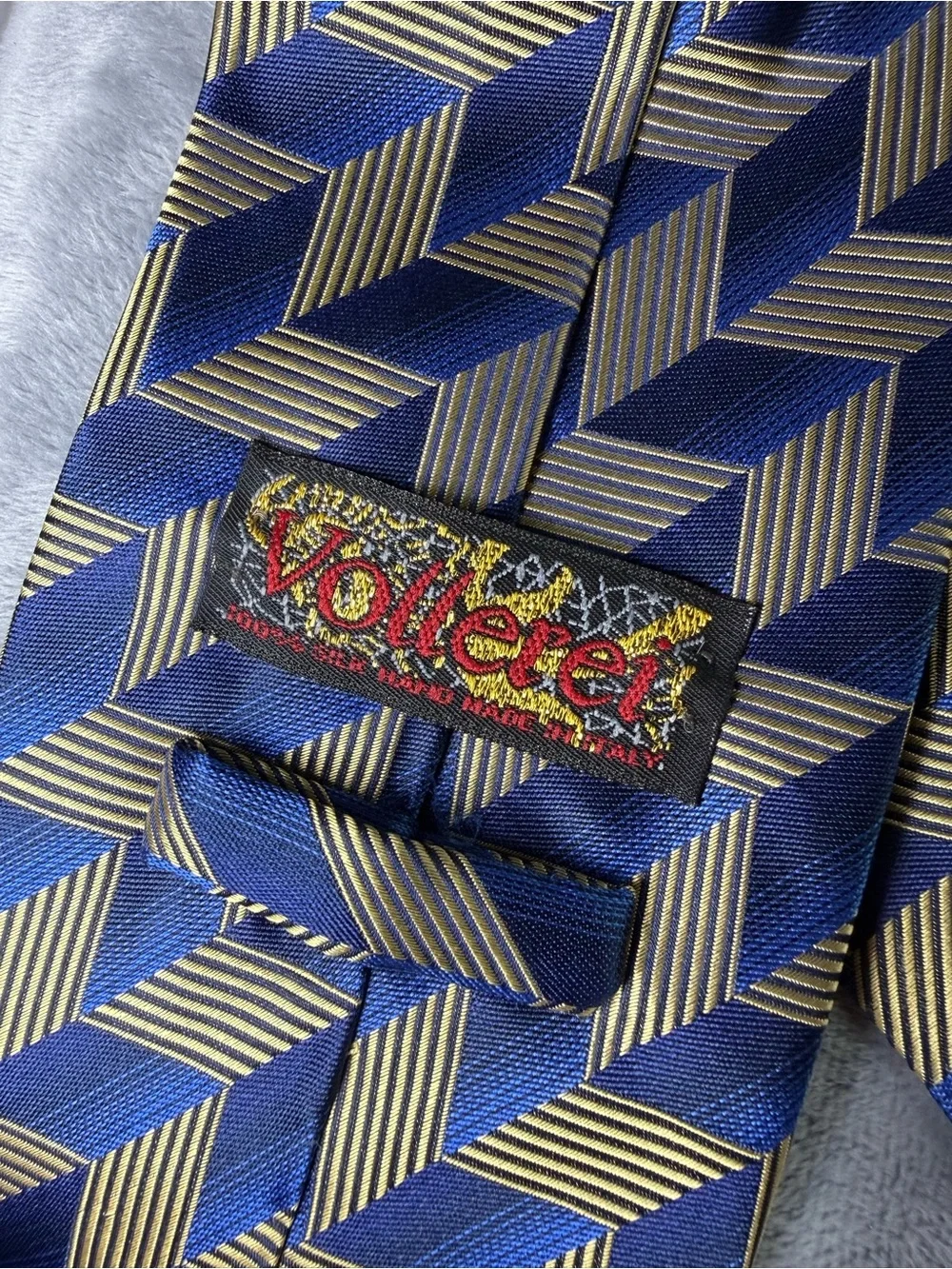 Vollerei Men's Silk Tie Blue Gold Optical Illusion Abstract Made In Italy
